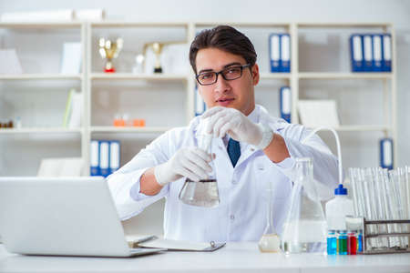 Young researcher scientist doing a water test contamination expe