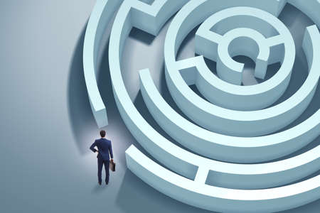 Businessman is trying to escape from maze labyrinthの写真素材