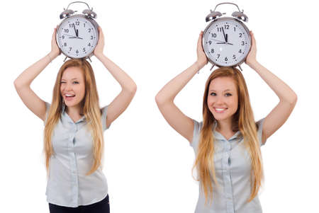 Young woman with clock on whiteの写真素材