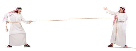 Arab in tug of war concept on whiteの写真素材