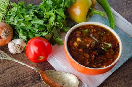Bowl of traditional soup Borscht on tableの写真素材