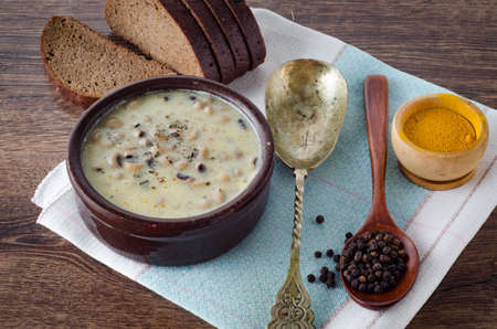 Mushroom soup served on the tableの写真素材