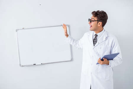 Funny doctor scientist making presentation in hospitalの写真素材