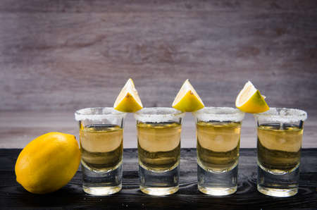 Tequila drink served in glasses with lime and saltの写真素材