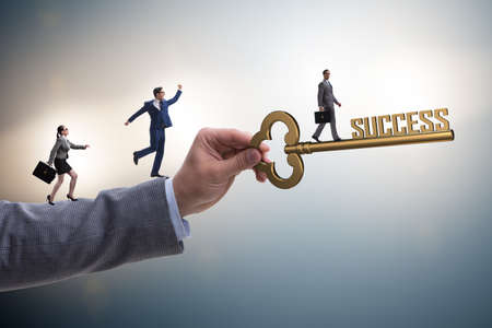 Businessman with key to success business conceptの写真素材