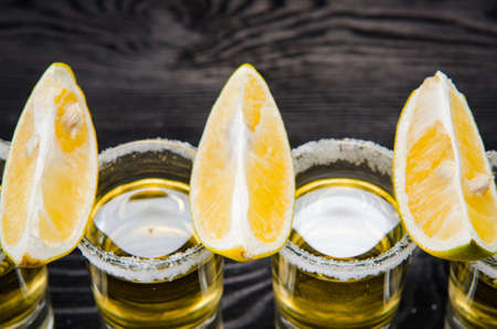 Tequila drink served in glasses with lime and saltの写真素材