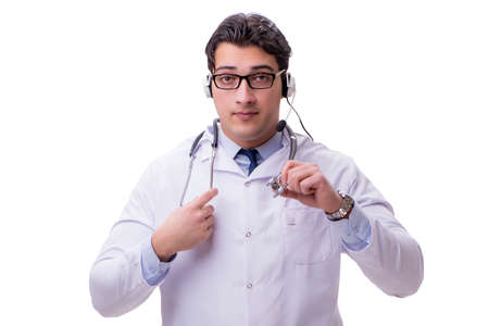 Young doctor with phone headset isolated on whiteの写真素材