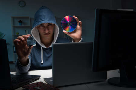 Hacker hacking computer at nightの写真素材