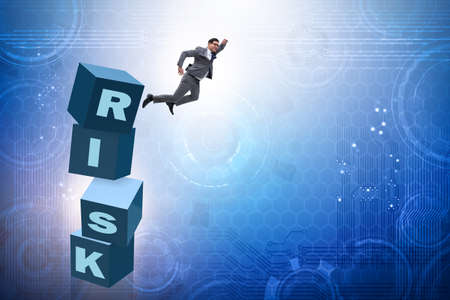 Businessman in risk and reward business conceptの写真素材