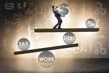 Businessman in debt and tax business conceptの写真素材