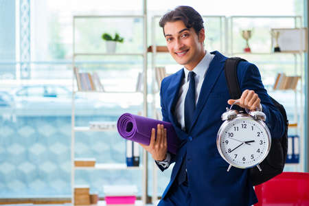 Man getting ready for sports break in the officeの写真素材