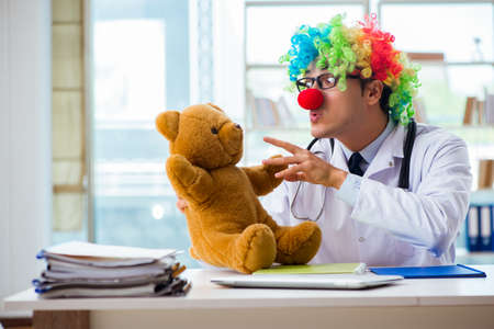 Funny pediatrician with toy in the hospital clinicの写真素材