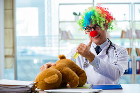 Funny pediatrician with toy in the hospital clinicの写真素材