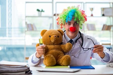 Funny pediatrician with toy in the hospital clinicの写真素材