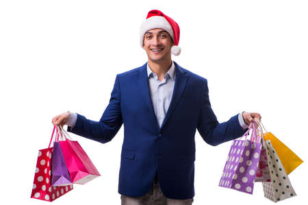 Young man with bags after christmas shopping on white backgroundの写真素材