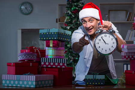 Man with many christmas gifts in boxesの写真素材