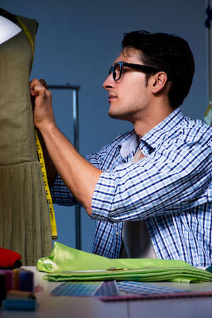 Male tailor working in sewer shopの写真素材