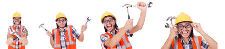 Funny construction worker with hammer and wrench isolated on whiの写真素材