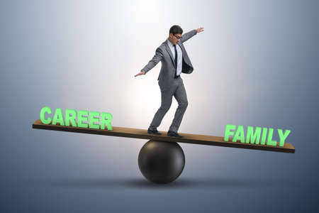 Businessman balancing between career and family in business concの写真素材