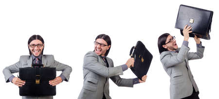 Young businessman in gray suit holding briefcase isolated on whiの写真素材
