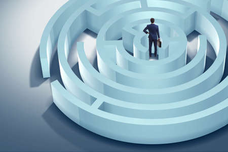 Businessman is trying to escape from maze labyrinthの写真素材