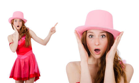 Pretty young wizard in mini pink dress isolated on whiteの写真素材