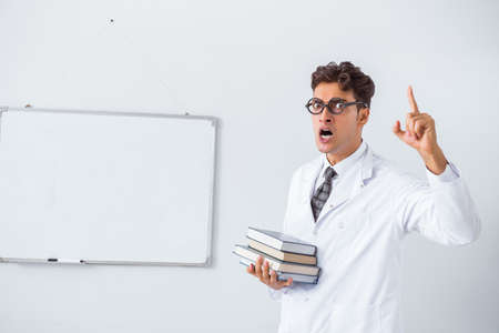 Funny doctor scientist making presentation in hospitalの写真素材