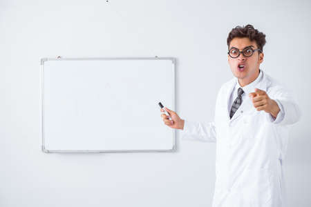Funny doctor scientist making presentation in hospitalの写真素材