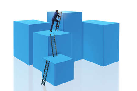 Businessman on top of block isolated on whiteの写真素材