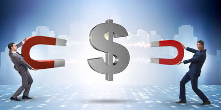 Businessman catching dollars on horseshoe magnetの写真素材