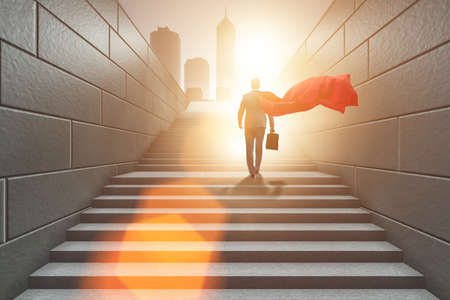 Businessman superhero successful in career ladder conceptの写真素材
