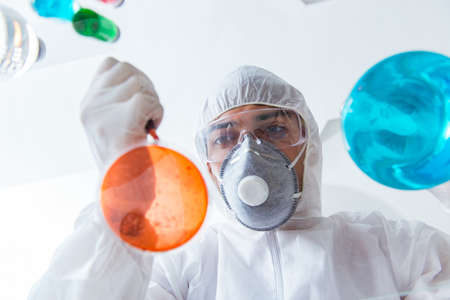 Chemist working in the laboratory with hazardous chemicalsの写真素材