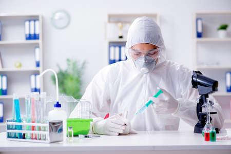 Scientist doing animal experiment in lab with rabbit