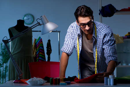 Male tailor working in sewer shopの写真素材
