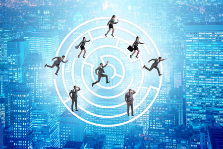 Business people getting lost in maze uncertainty conceptの写真素材