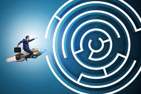 Uncertainty concept with businessman lost in maze labyrinthの写真素材