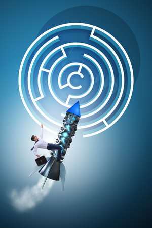 Uncertainty concept with businessman lost in maze labyrinthの写真素材