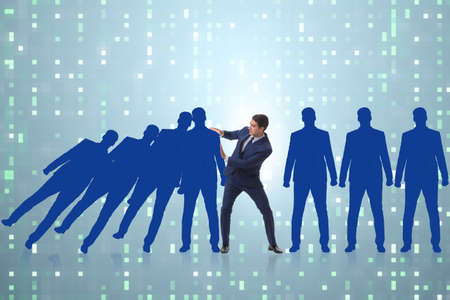 Businessman in domino effect business conceptの写真素材