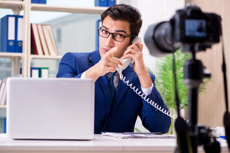 Businessman recording a video for vlog
