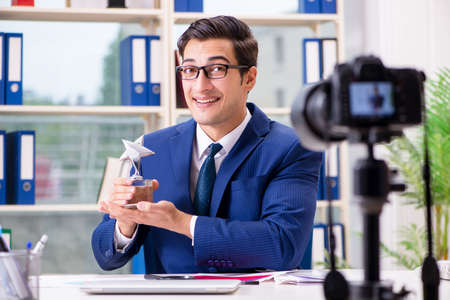 Businessman recording a video for vlogの写真素材