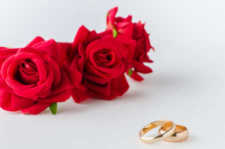 Wedding concept with rings and rosesの写真素材
