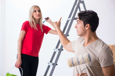 Young family doing painting job during home renovationの写真素材