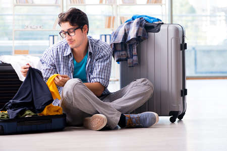 Young man preparing for vacation travelの写真素材