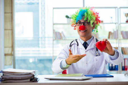 Child cardiologist with stethoscope and red heartの写真素材