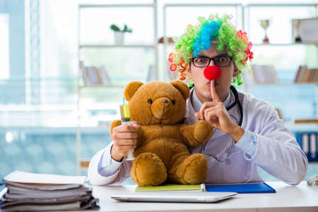 Funny pediatrician with toy in the hospital clinicの写真素材
