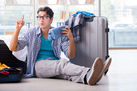 Young man preparing for vacation travelの写真素材