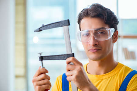 Furniture carpenter working in the workshop