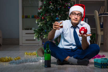 Businessman celebrating christmas at home aloneの写真素材