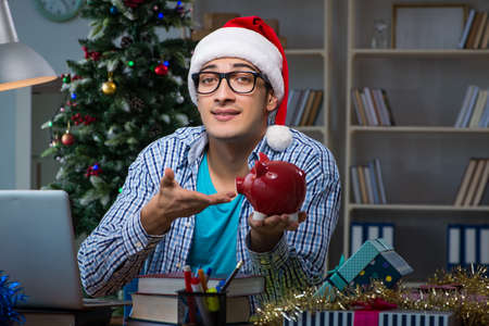Young man working at home on christmas dayの写真素材