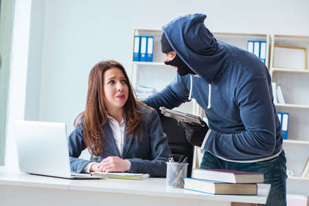 Criminal taking businesswoman as hostage in office